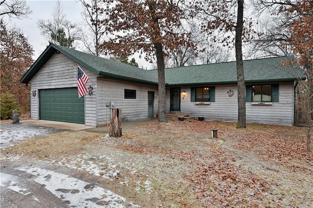 ranch-style home featuring a garage