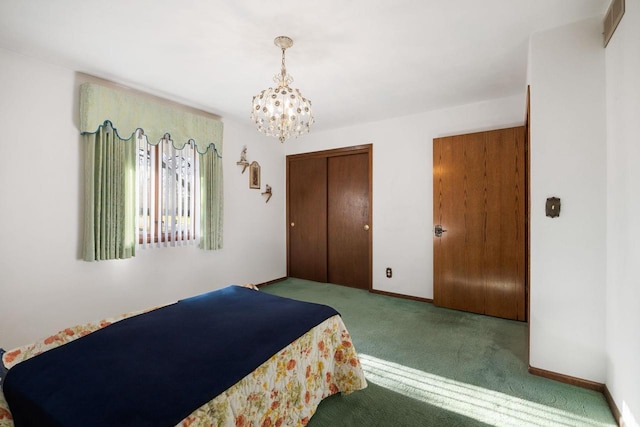 bedroom with carpet, a notable chandelier, and a closet