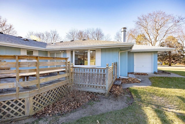 back of property featuring a garage