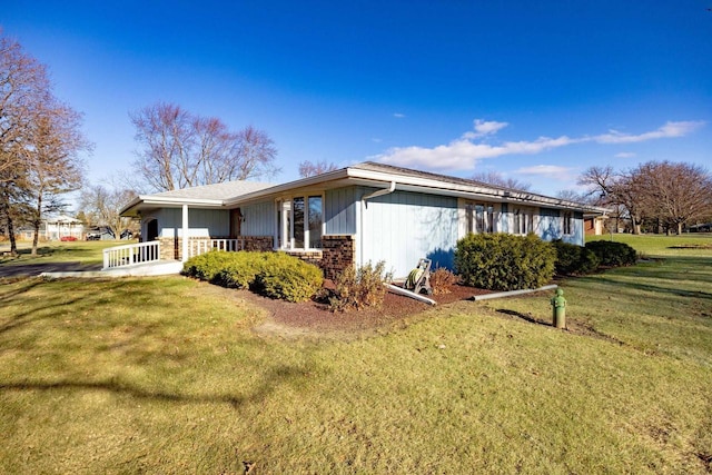 view of property exterior featuring a lawn and a porch