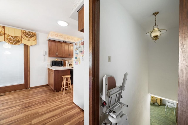 kitchen with light hardwood / wood-style flooring