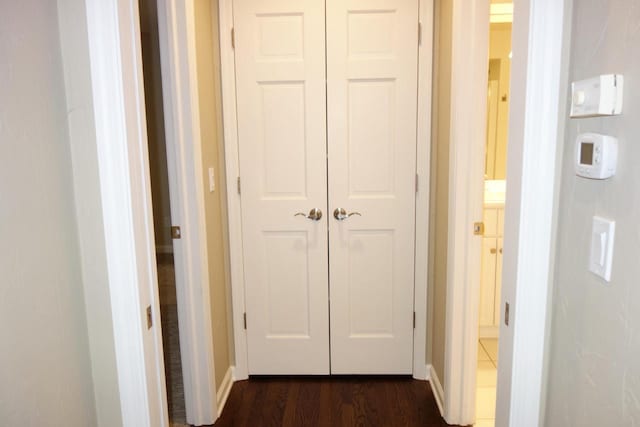 hall with dark hardwood / wood-style floors