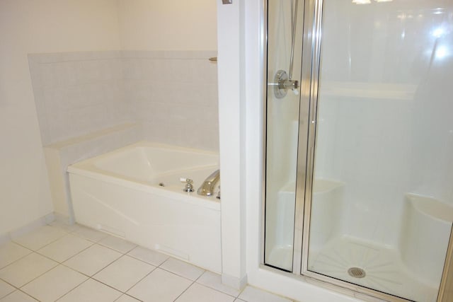 bathroom featuring tile patterned flooring and plus walk in shower