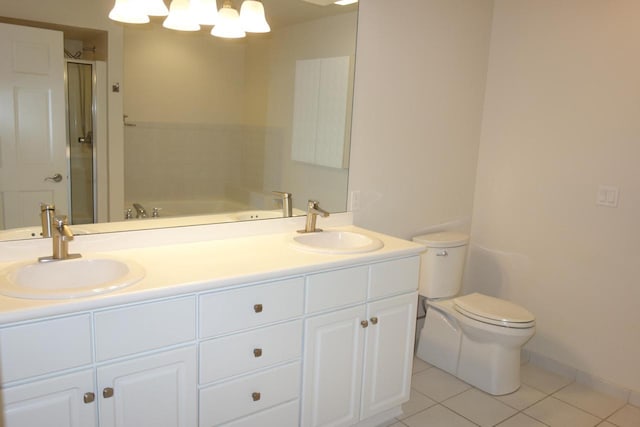 full bathroom with toilet, vanity, tile patterned floors, and independent shower and bath