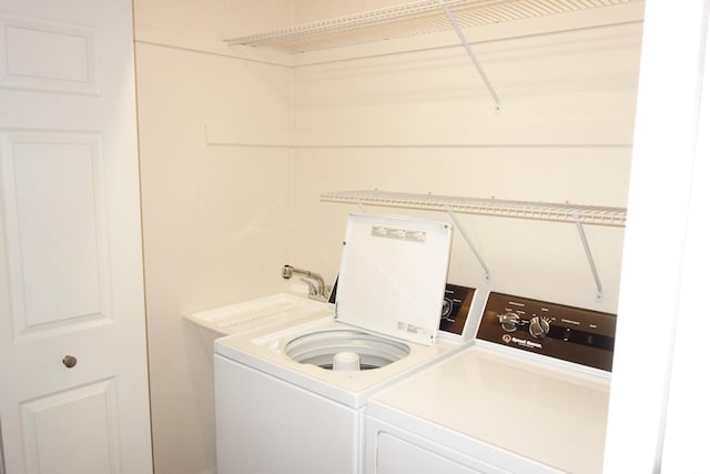 laundry area with independent washer and dryer