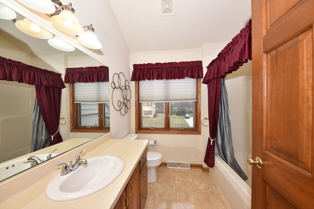 full bathroom with shower / bath combo, tile patterned flooring, vaulted ceiling, toilet, and vanity