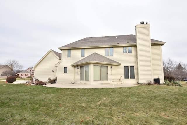 back of property featuring a patio area and a yard