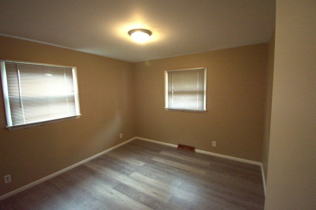 empty room featuring hardwood / wood-style flooring