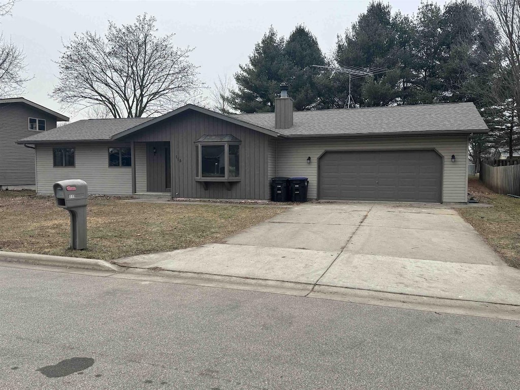 single story home with a garage