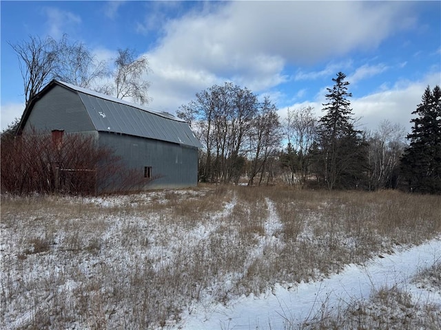 yard covered in snow with an outdoor structure