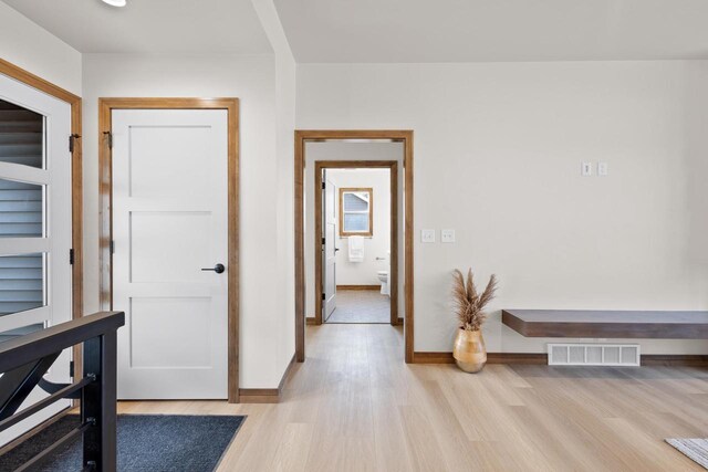 hallway with light wood-type flooring