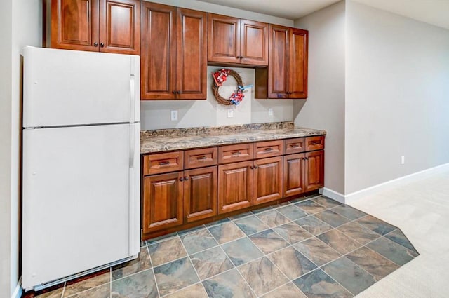 kitchen featuring white fridge