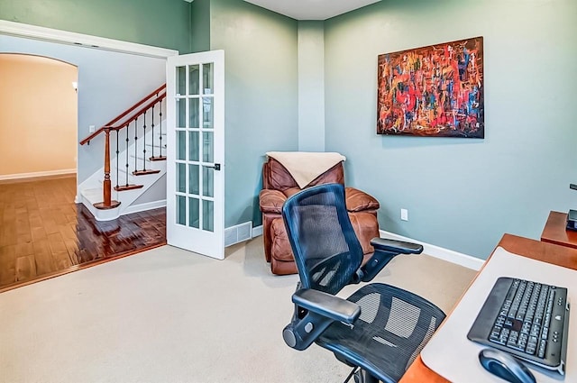 home office with hardwood / wood-style flooring