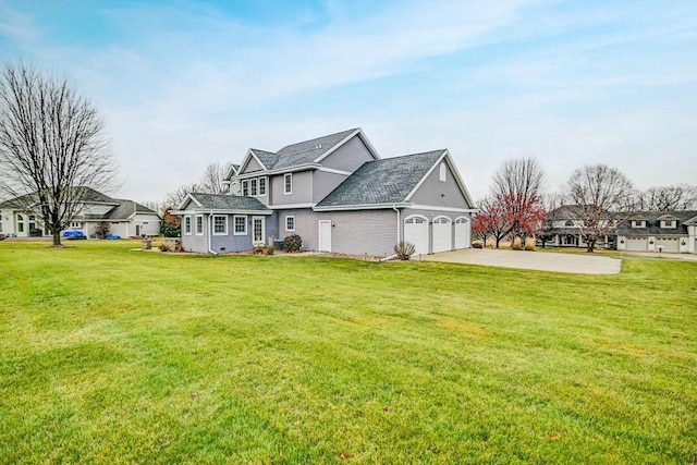 exterior space with a yard and a garage