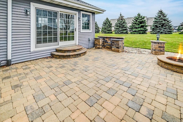 view of patio / terrace featuring an outdoor fire pit