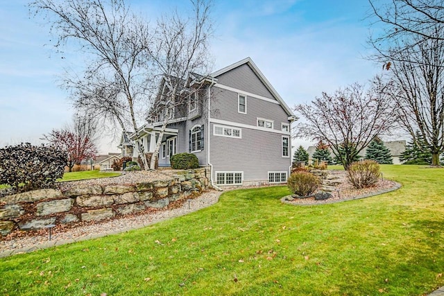 view of property exterior with a lawn