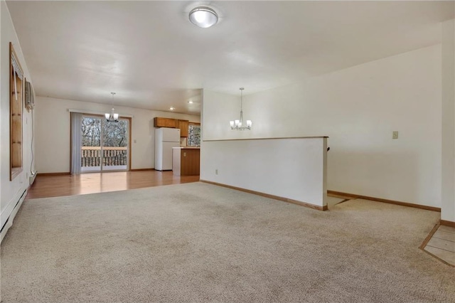 unfurnished living room with light carpet and a chandelier