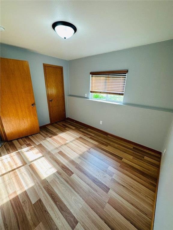 unfurnished bedroom featuring light hardwood / wood-style flooring