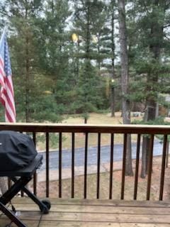 wooden deck featuring area for grilling