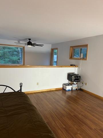 unfurnished bedroom with hardwood / wood-style flooring and ceiling fan