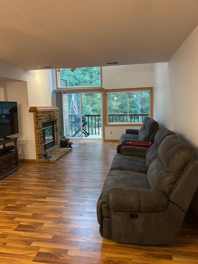 living room featuring a fireplace and hardwood / wood-style flooring