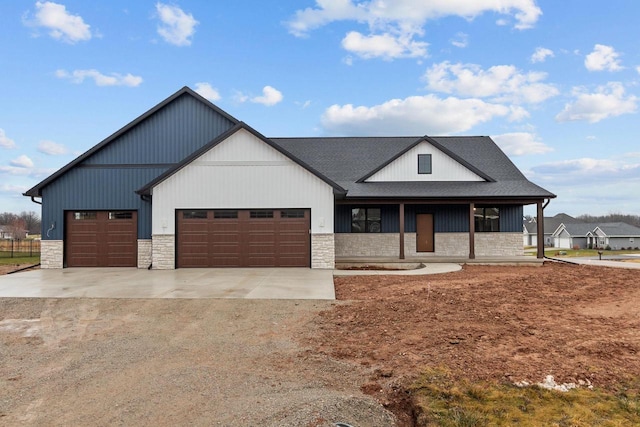 modern inspired farmhouse featuring a garage and a porch