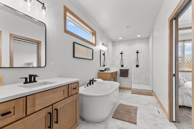 bathroom with vanity and plus walk in shower