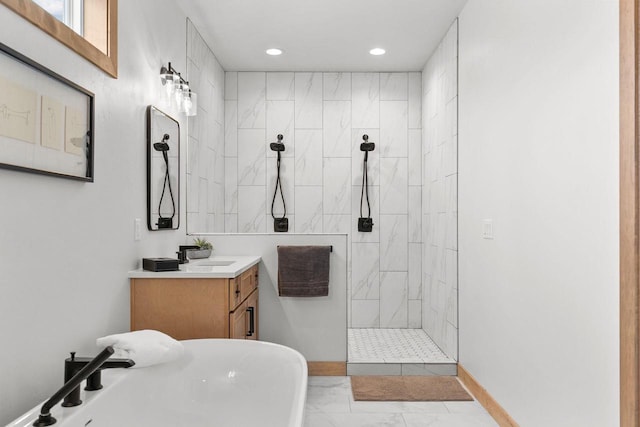 bathroom featuring vanity and separate shower and tub