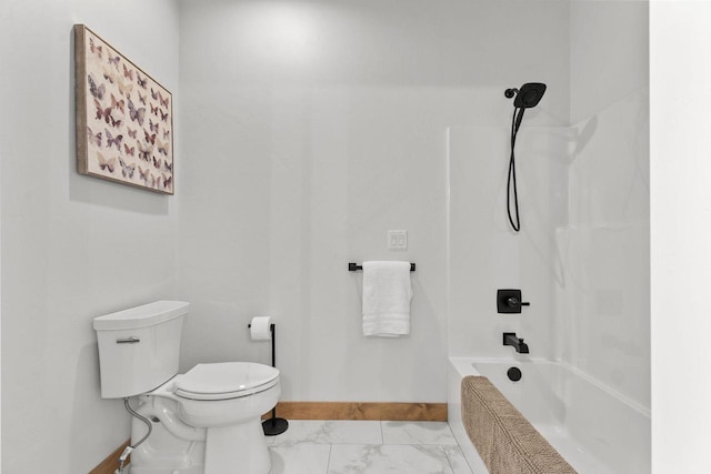 bathroom with bathing tub / shower combination and toilet