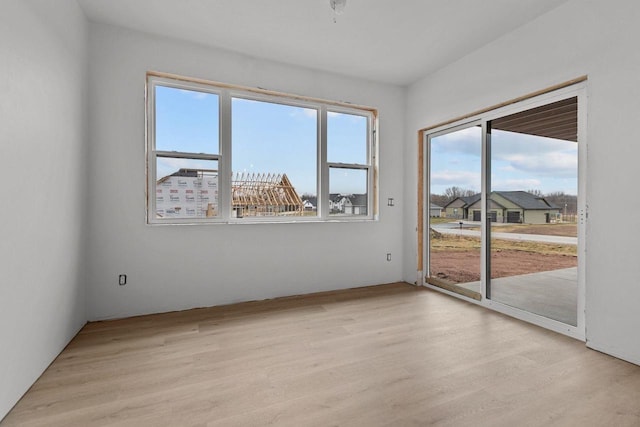 unfurnished room featuring light hardwood / wood-style floors