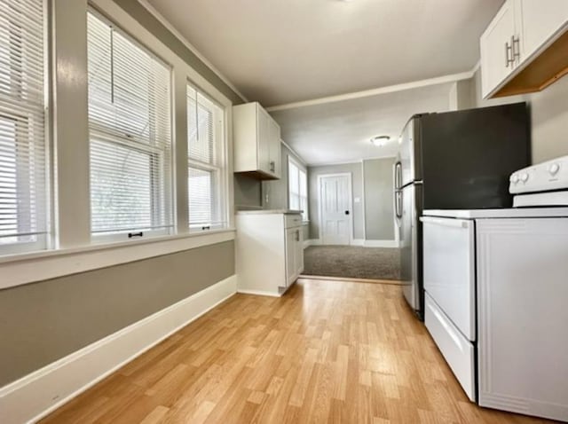 kitchen with white cabinetry, light hardwood / wood-style flooring, and white range