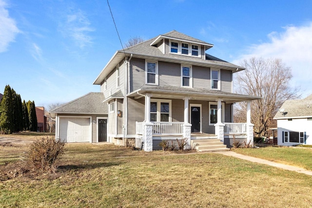 view of front of house featuring a porch, a garage, and a front lawn