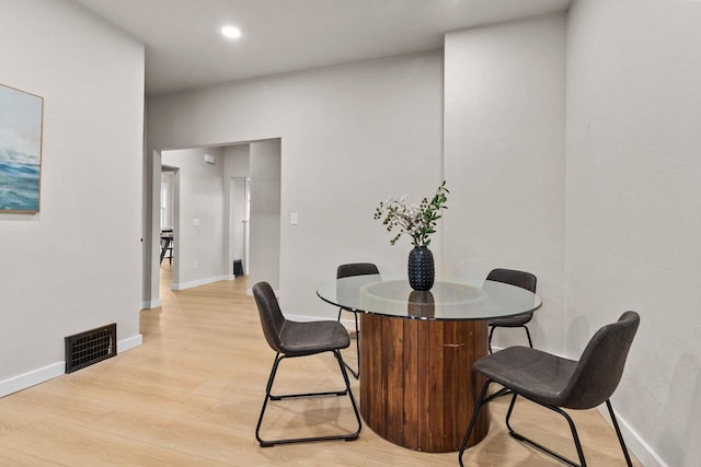 dining room with light hardwood / wood-style flooring