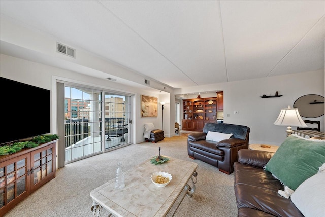 carpeted living room with visible vents