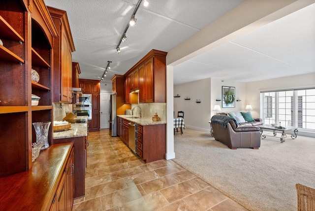 kitchen with open shelves, stainless steel appliances, light colored carpet, decorative backsplash, and a sink