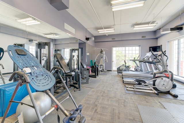 gym with carpet floors and visible vents