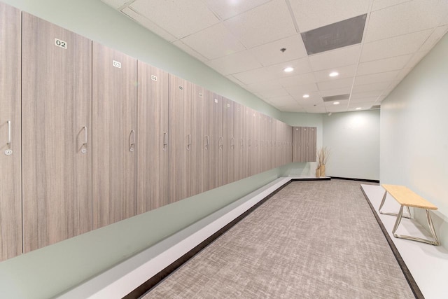 empty room featuring recessed lighting, light colored carpet, and a paneled ceiling