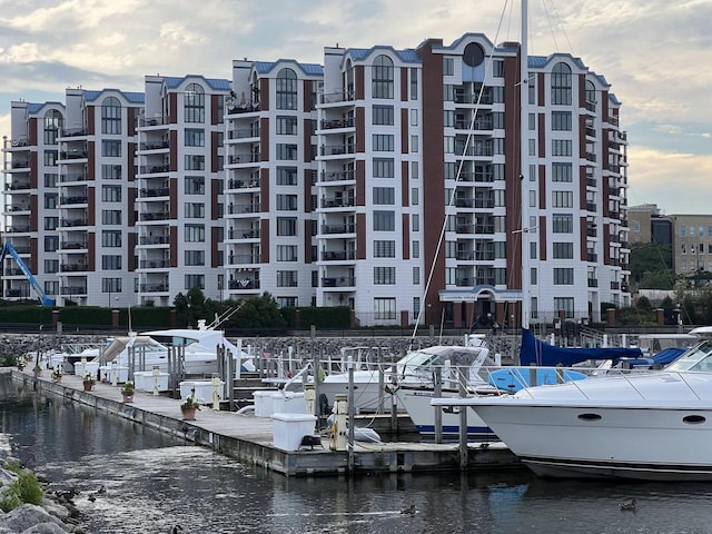 view of property featuring a view of city and a water view