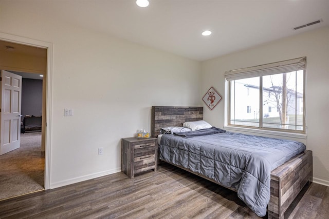 bedroom with hardwood / wood-style floors