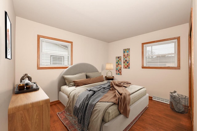 bedroom featuring dark wood-type flooring