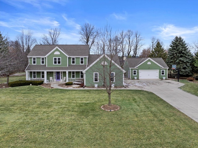 view of front facade with covered porch, a garage, and a front yard