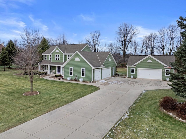 view of front of house featuring a porch, a garage, and a front lawn