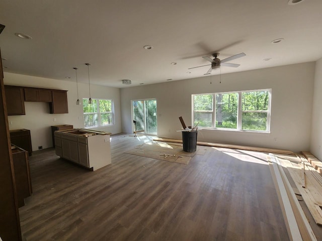 236 Russell Ct, Jefferson, WI 53549 - unfurnished living room featuring dark wood-style flooring, a ceiling fan, and recessed lighting