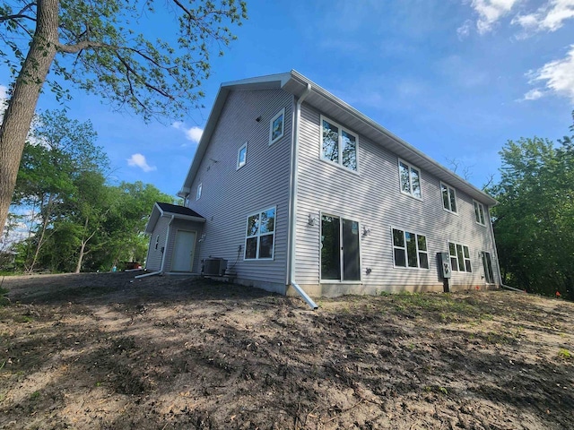 236 Russell Ct, Jefferson, WI 53549 - rear view of property featuring central air condition unit