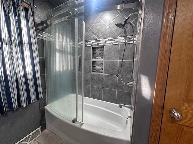 803 E Birch St, Spencer, WI 54479 - bathroom featuring tile patterned flooring and tiled shower / bath combo