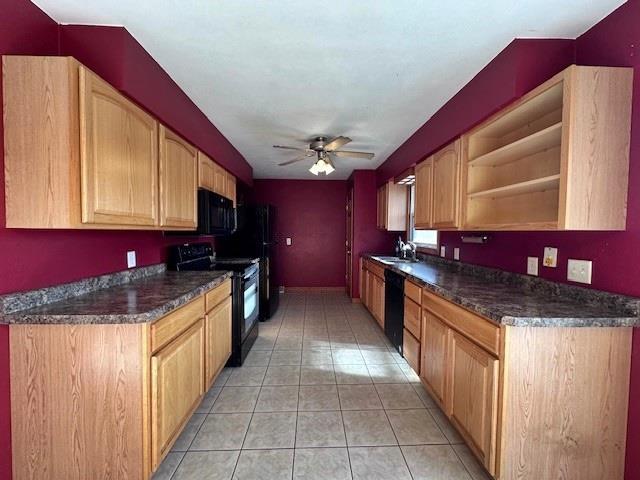 803 E Birch St, Spencer, WI 54479 - kitchen featuring light brown cabinetry, ceiling fan, sink, black appliances, and light tile patterned floors