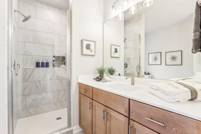 full bathroom featuring a stall shower and vanity