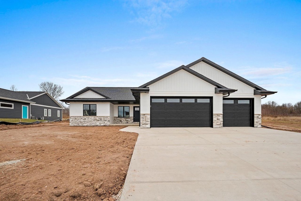 modern farmhouse style home with a garage