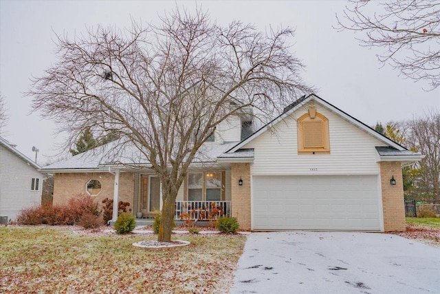 view of front of house featuring covered porch and a garage