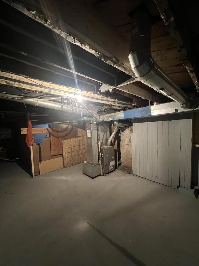 basement featuring heating unit